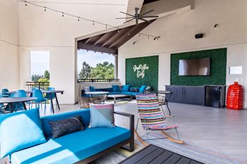 Sky deck with soft seating, televisions and bar - perfect for entertaining